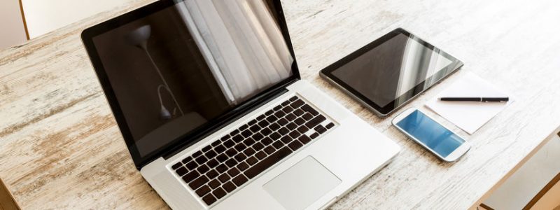 Informatique 33059033 - a laptop computer, a tablet pc and a smartphone on a desktop.